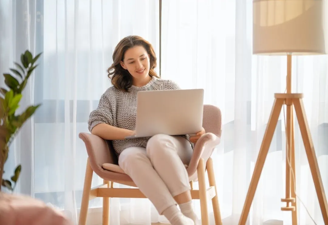 Person in comfortable home setting on a virtual coaching session
